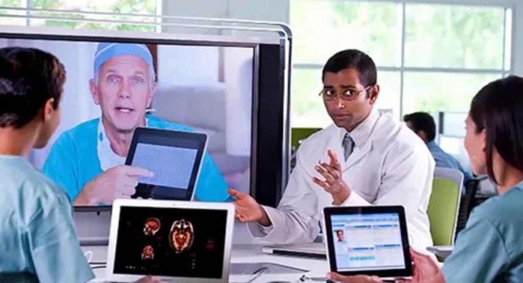 Doctor using augmented reality for remote consultation with patient data visualized in 3D.