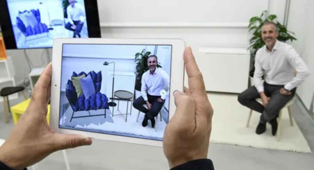 AR app displaying a virtual couch placement in a living room which describes AR in Retail stores.